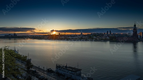 Canvas Print Bird's eye view of the cityscape of Stockholm, Sweden reflecting in a river at s