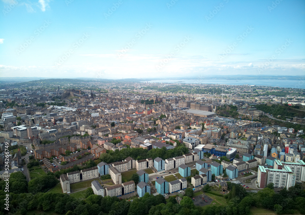 Aerial drone sunrise view of suburban houses in Edinburgh, Scotland, UK