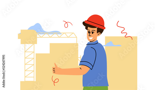 A male builder in a construction helmet on the background of a construction site. The construction process