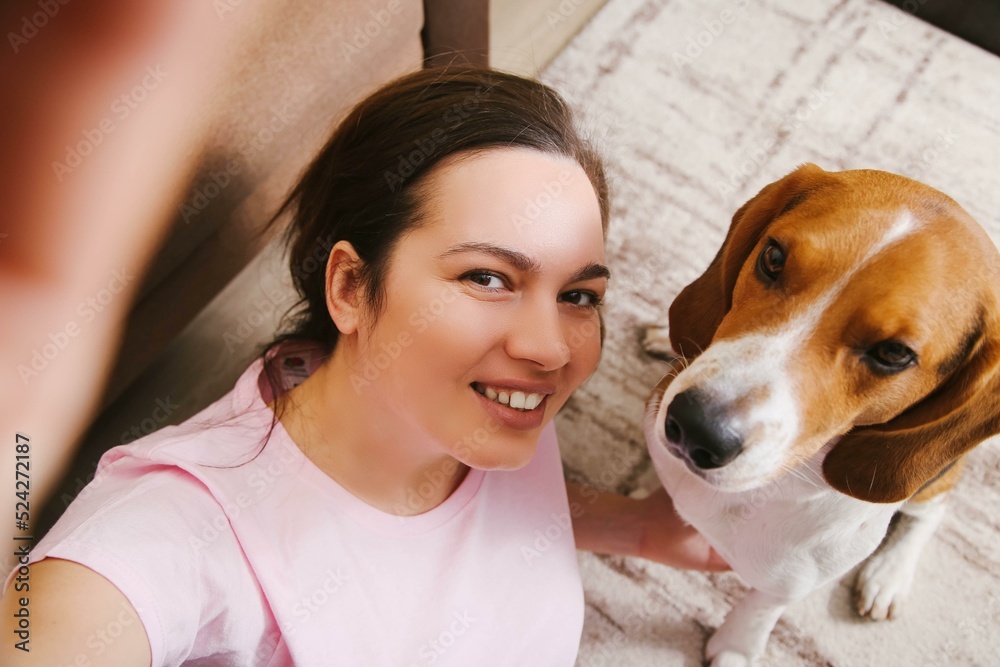 A girl takes a selfie with a dog A girl takes a selfie with a dog