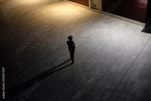 silhouette of a person in a corridor