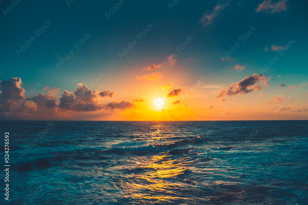 Bright orange sunset sun over blue ocean. Sunlight reflected in dark water. Amazing summer scenery. Beautiful nature landscape. Stunning natural background. Impressive colorful seascape. Travel shot Stock Photo | Adobe Stock