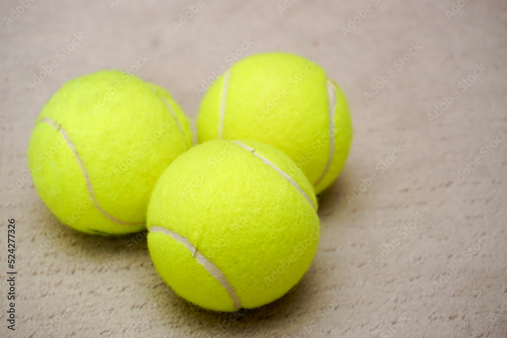 Three tennis balls on isolated background