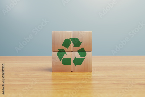 Recycle icon symbol logo on wood natural environment - Eco ecological green energy to save the planet - Reciclying to save planet earth and nature photo