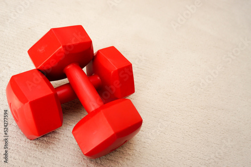 Set of red dumbbells on isolated background