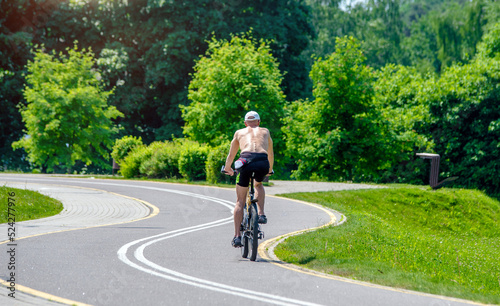 Cyclist ride on the bike path in the city Park 