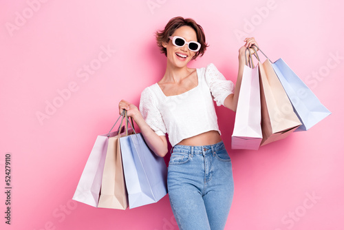 Photo of adorable nice satisfied girl wear white top denim jeans toothy beami...