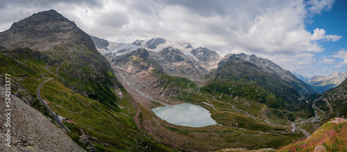 View across a glacial lake from Sustenpass in Switzerland near Andermatt. Landscapes of the mountains and the nature of the Susten region.