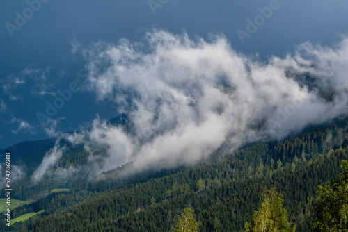 low hanging clouds and fog in the mountains at a summer day © Chamois huntress