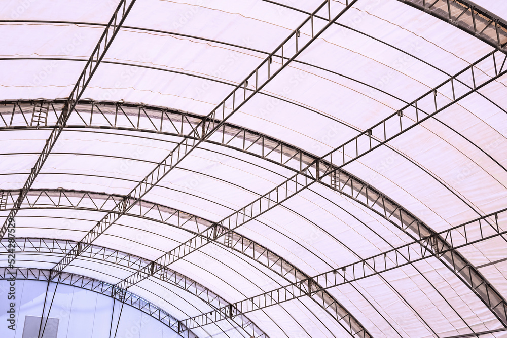 View from inside of metal roof structure with canvas of large dome event tent View from inside of metal roof structure with canvas of large dome event tent