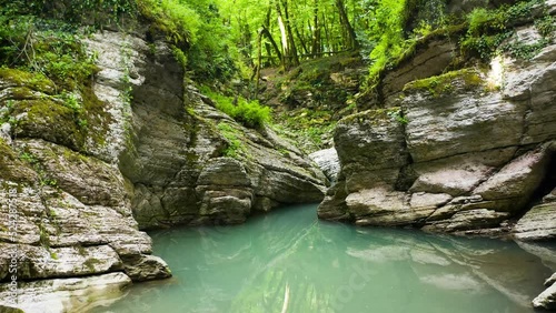 Wet canyon of the Psakho river. Mountain river with blue water. Sochi, Russia.