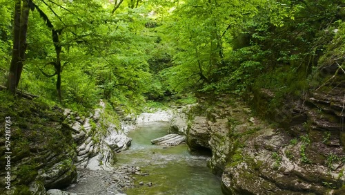 Wet canyon of the Psakho river. Mountain river with blue water. Sochi, Russia.