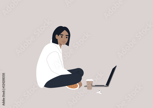 A young female Caucasian character sitting on the floor and working on their laptop with crossed legs
