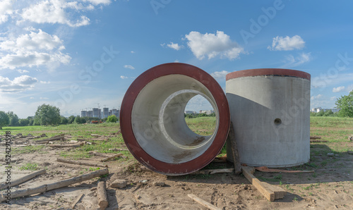 Wallpaper Mural Reinforced concrete storm sewer pipes of large diameter stacked at a construction site. Sewer Large diameter pipes. Torontodigital.ca