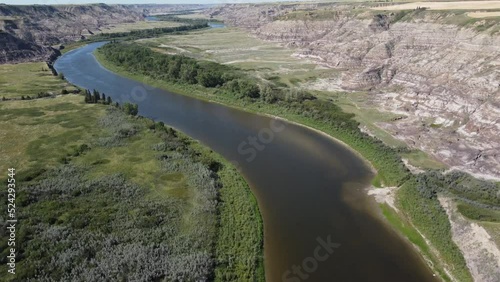 Aerial flight over the Red Deer River and the Canadian Badlands during summer near Drumheller Alberta.
 photo