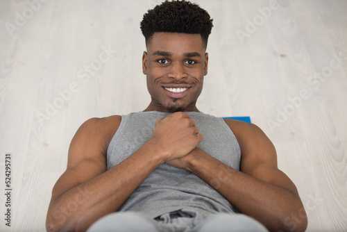 muscular man performing sit ups