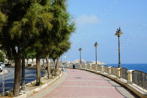 Sliema promenade, walking trail along the coast in Malta island, under a sunny day of summer
