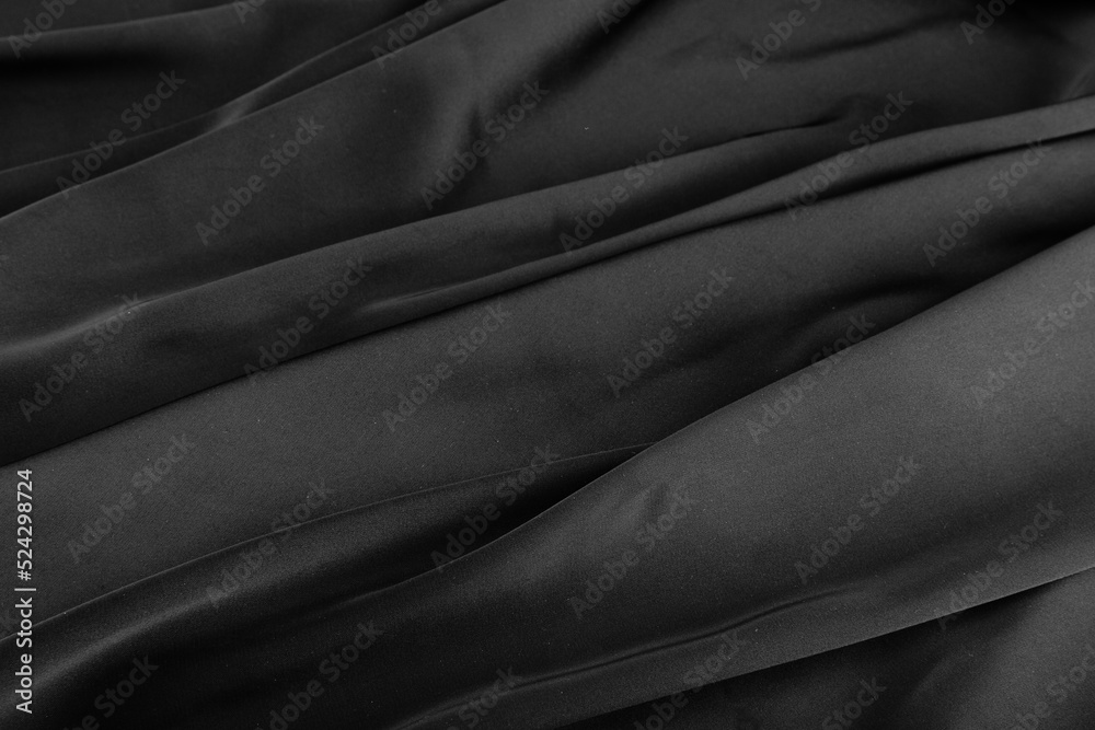 Fototapeta premium Folds of black silk fabric.