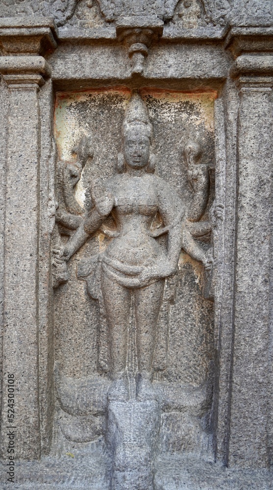 Bas relief rock cut sculptures of gods, people and animals are carved prominently in the monolithic cave temples at Mahabalipuram, Tamil nadu, India