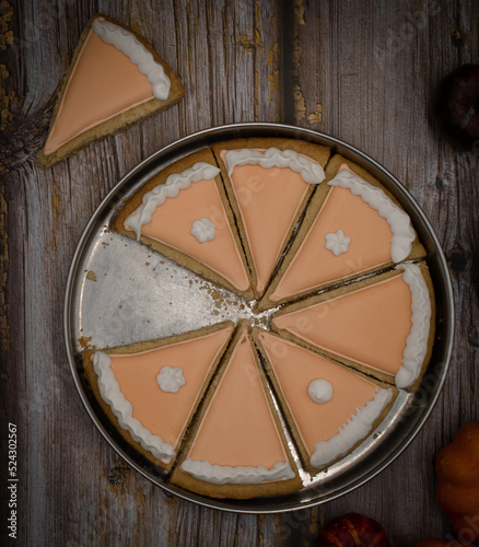 Pumpkin pie cookies on wooden rustic table copy space