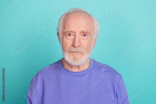 Photo of calm aged grandparent look camera isolated on vibrant aquamarine color background