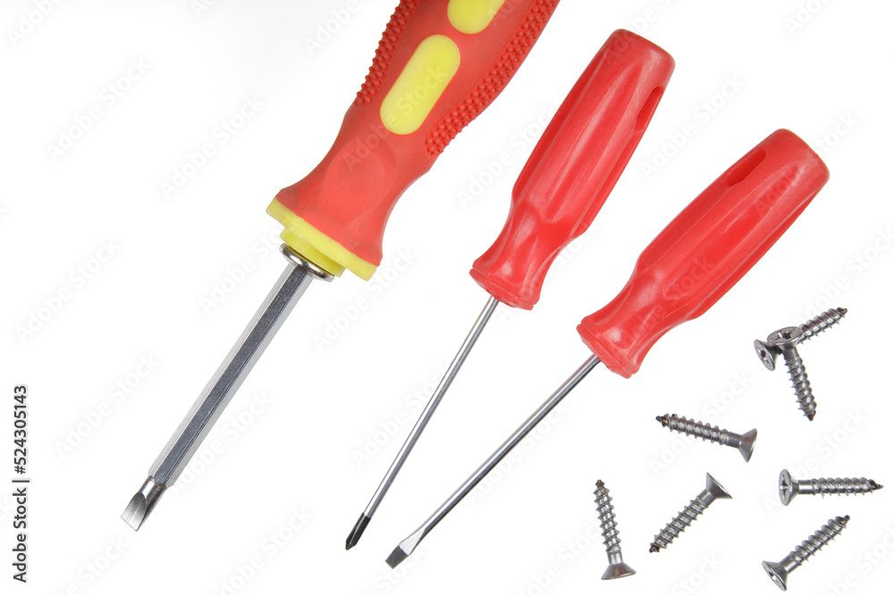 Flat Lay of close up of screwdrivers and screws Flat Lay of close up of screwdrivers and screws