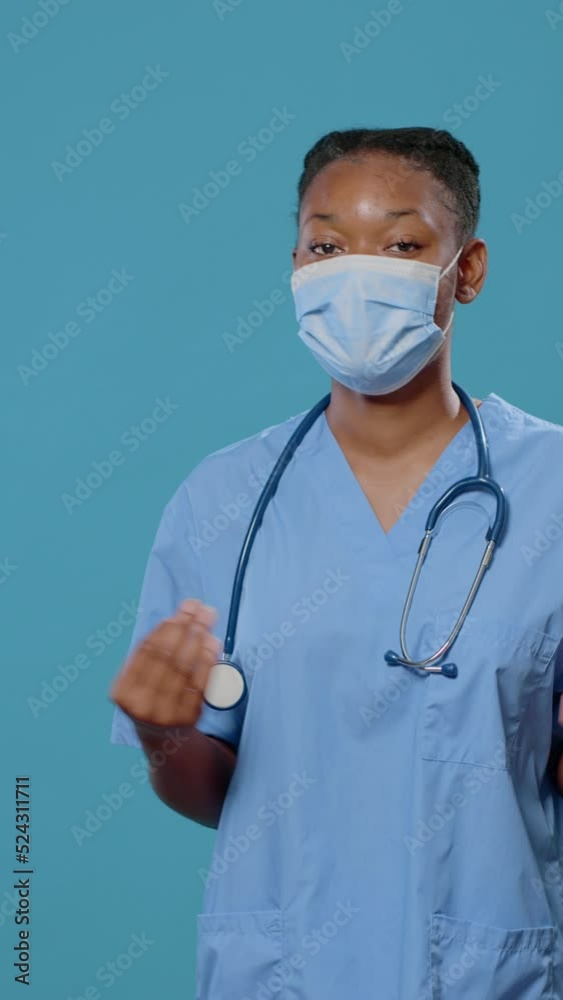 POV of woman nurse using video call to explain healthcare, wearing face mask for protection against coronavirus in studio. Medical assistant talking on online remote video conference POV of woman nurse using video call to explain healthcare, wearing face mask for protection against coronavirus in studio. Medical assistant talking on online remote video conference