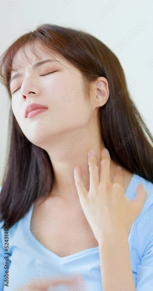 woman scratching her face