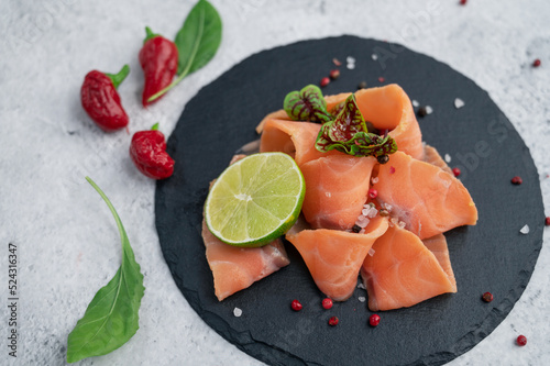 Fresh salmon slices with pe...