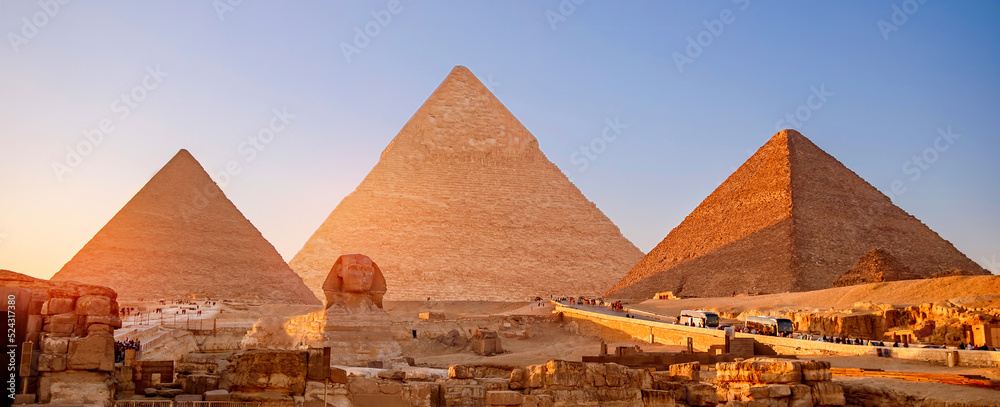 Banner view of famous wonder of world Sphinx and pyramids Giza, Egypt sunset - obrazy, fototapety, plakaty 