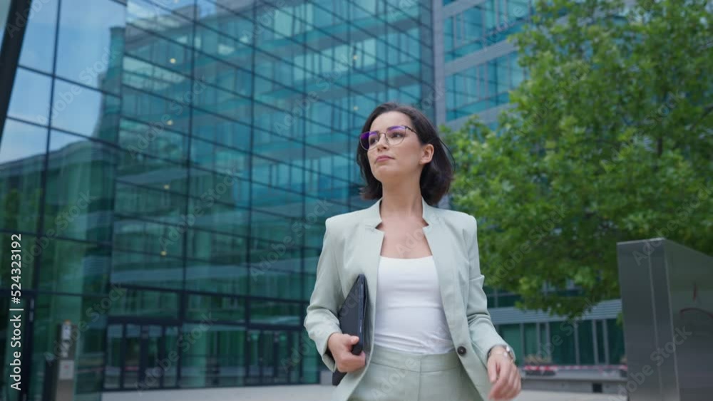 Business woman go to working at office building district in morning rush hour Business woman go to working at office building district in morning rush hour