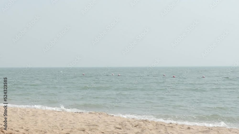 Beach Sand and Sea. Pattaya beach which one of the famous sea locations in Thailand. Represent vacation relaxing. Open country for travelers after Covid 19 pandemic. Sea waves and sand with blue sky. Beach Sand and Sea. Pattaya beach which one of the famous sea locations in Thailand. Represent vacation relaxing. Open country for travelers after Covid 19 pandemic. Sea waves and sand with blue sky.