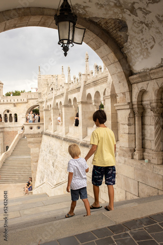 Child, boy, visiting the castle in Budapest on a summer day