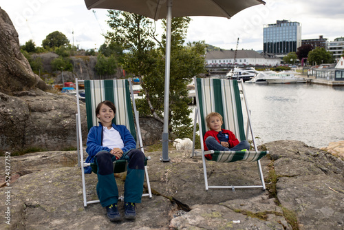 Beautiful town Kristiansand in Norway, family visiting Norway for summer vacation photo