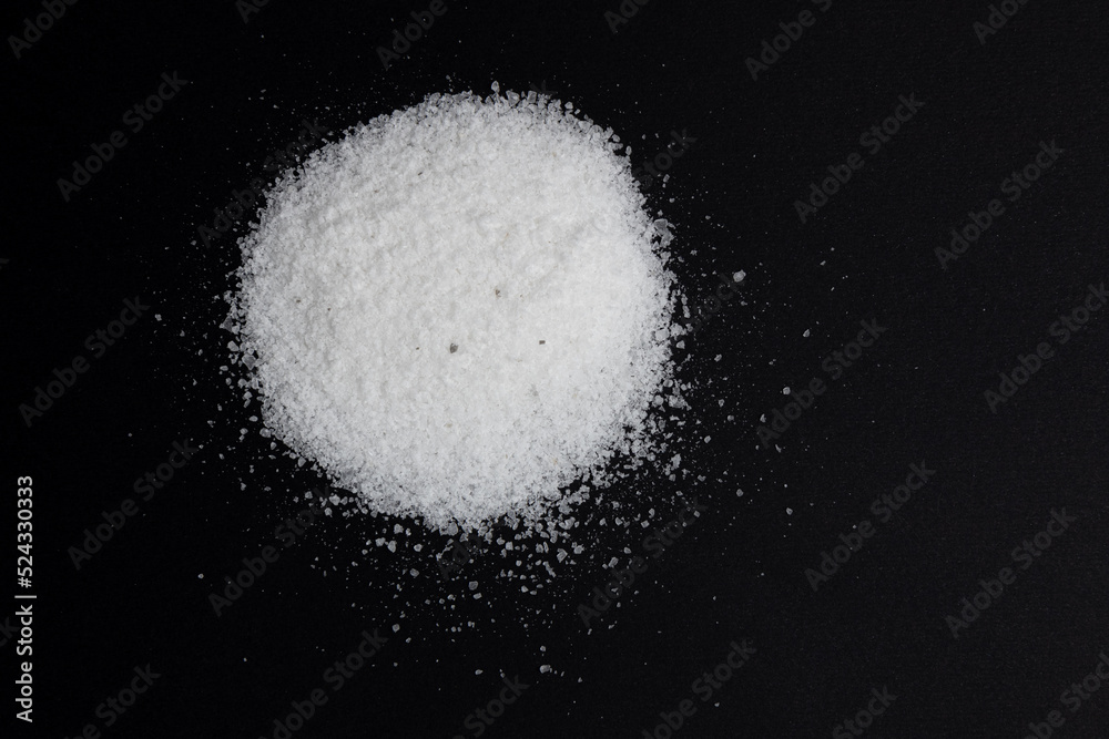 pile of salt isolated on black background