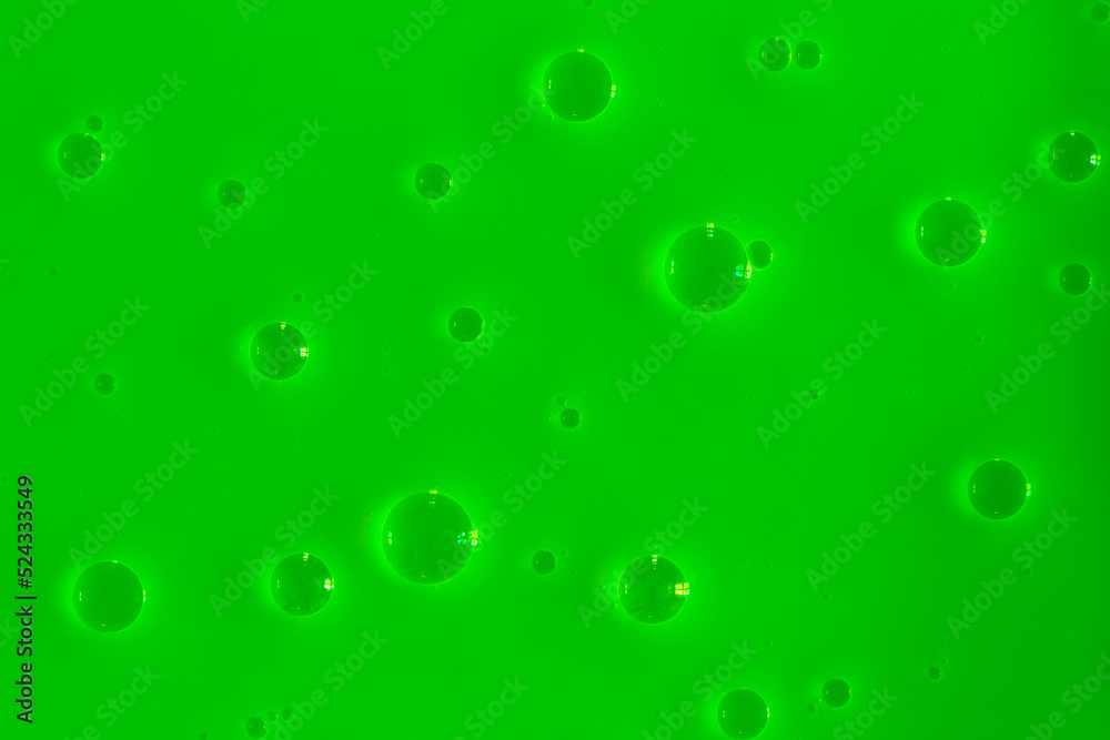 Bubble green background texture. Berry gel to cleanse the skin of the face and body. Spa treatments, skin care. Bath foam, detergent. Slime lime