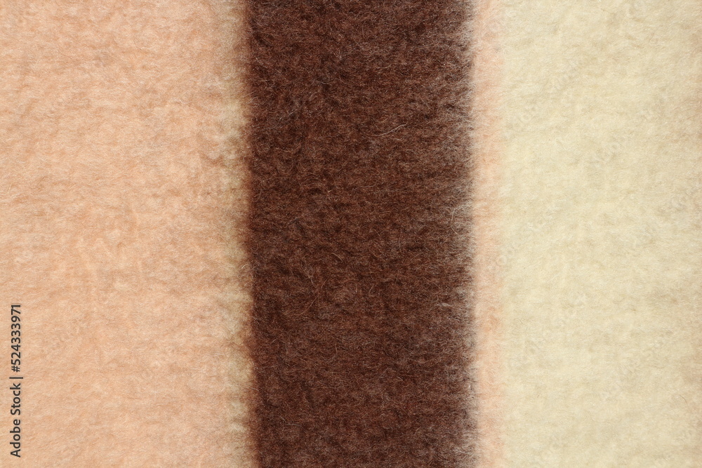 Fototapeta premium Texture of a warm woolen blanket close-up. Abstract background.