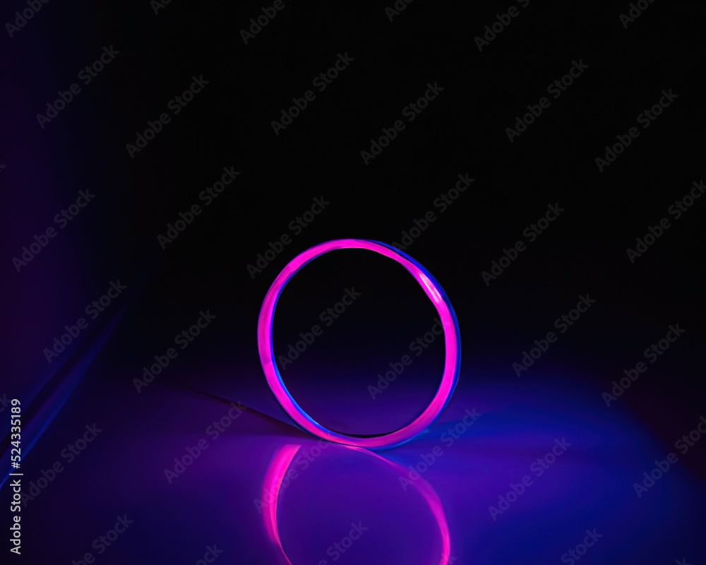 light rings, pink and blue, magenta and turquoise with reflections on the floor, black background, moving light rings light rings, pink and blue, magenta and turquoise with reflections on the floor, black background, moving light rings