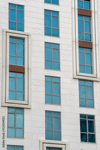 Modern high-rise building. A number of identical windows.