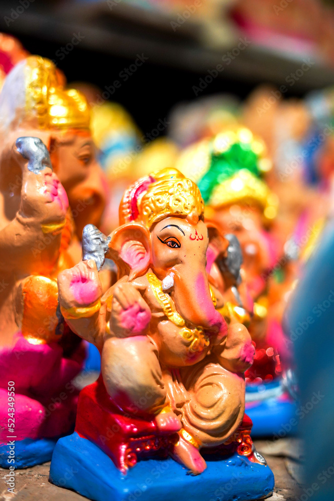 Many Lord Ganesha (also known as Ganpati in hindi) idols kept in a shop before Ganesh Chaturthi Many Lord Ganesha (also known as Ganpati in hindi) idols kept in a shop before Ganesh Chaturthi