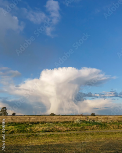 Rural landscape with imposing cloud formation similar to a nuclear explosion