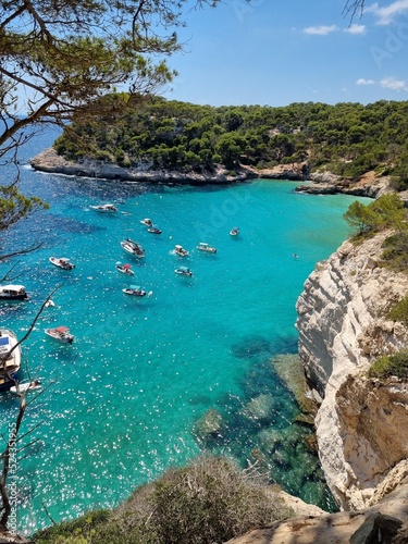 View of turquoise sea in beautiful bay Cala Mitjaneta in Menorca