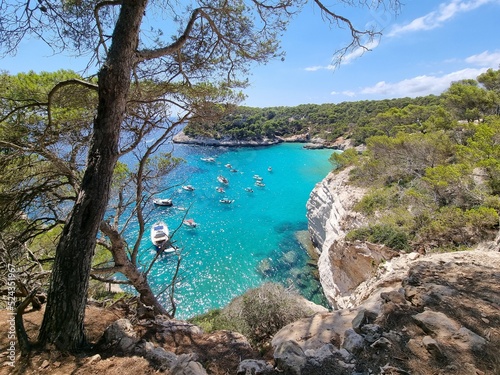 View of turquoise sea in beautiful bay Cala Mitjaneta in Menorca
