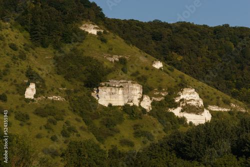 Wallpaper Mural Rock formations on hills of Seine river in Normandy in golden sunlight during sunset surrounded by forest, Poses, France Torontodigital.ca