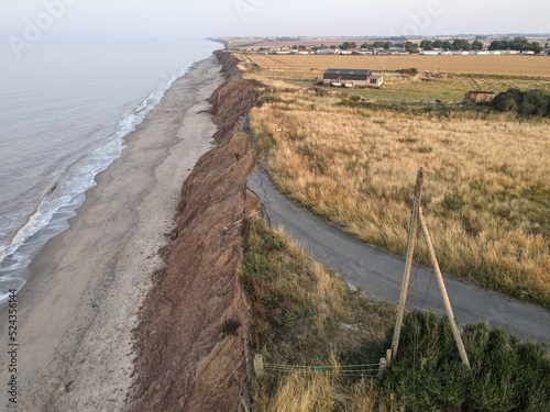 Fotografie A road falls into the sea on the coastline with Europe's fastest coastal erosion