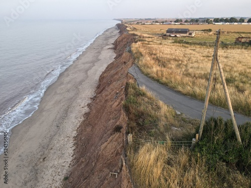 Fotografie A road falls into the sea on the coastline with Europe's fastest coastal erosion