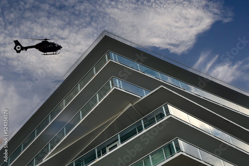 office building with clouds helicopter