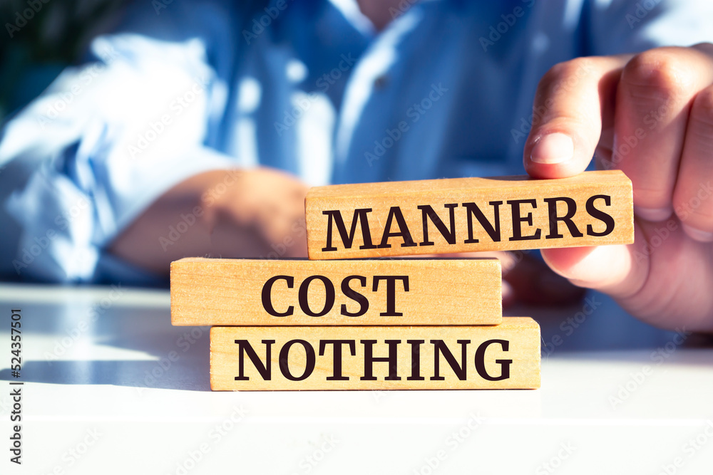 Wooden blocks with words 'Manners Cost Nothing'. Wooden blocks with words 'Manners Cost Nothing'.