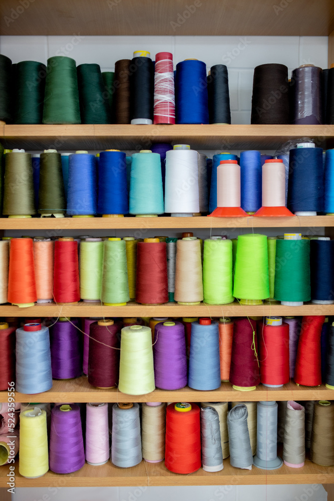 Sewing threads multicolored background closeup Sewing threads multicolored background closeup