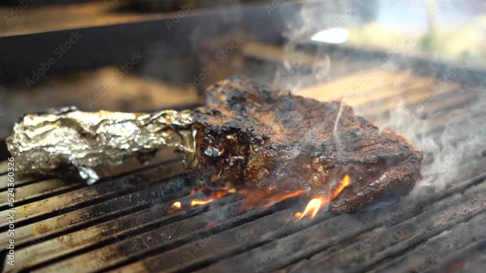 Excellent cut of meat burning on the grill Excellent cut of meat burning on the grill